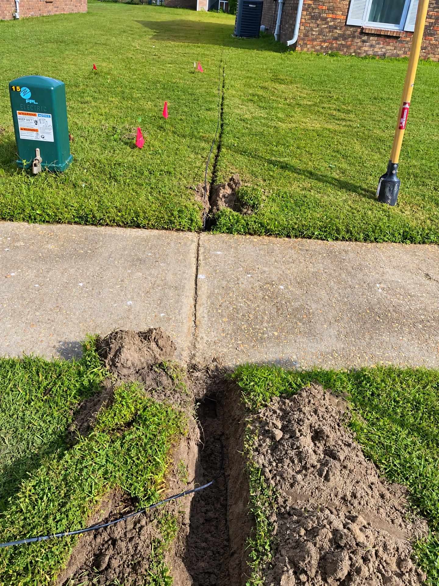 Fiber line run under a sidewalk to a home